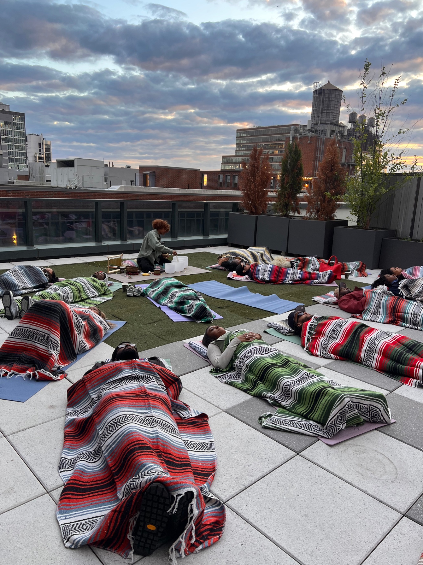 Community sound bath under the open sky on a Manhattan rooftop