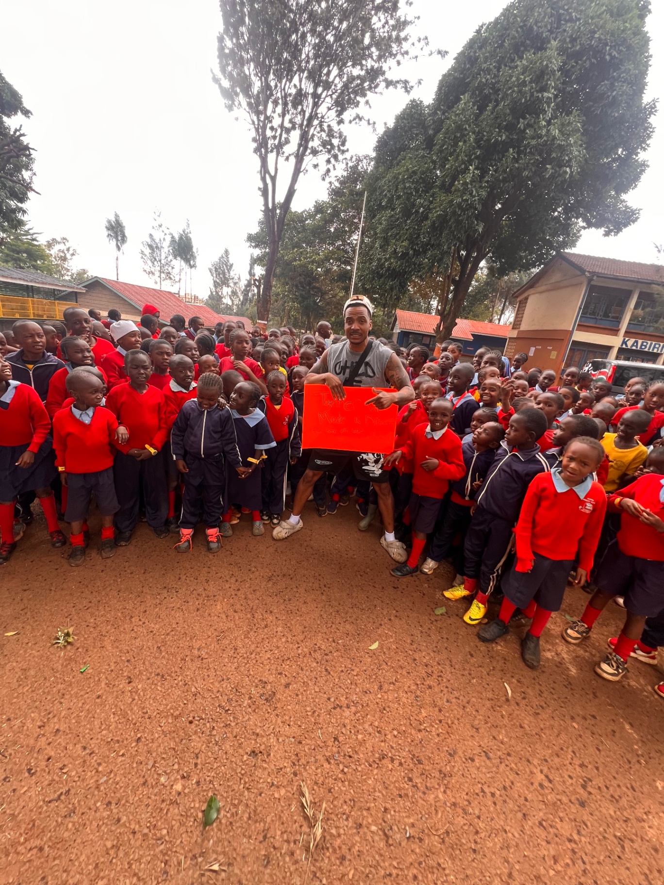 Brandon with schoolchildren in Kenya during a community visit